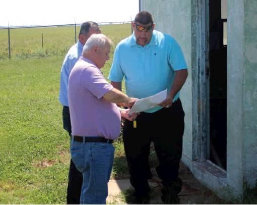 City administrator J.C. Moser explains the city’s well field operations to representatives from Filtra Systems for a possible test of a new filtration system. Bob Henline | The Cordell Beacon