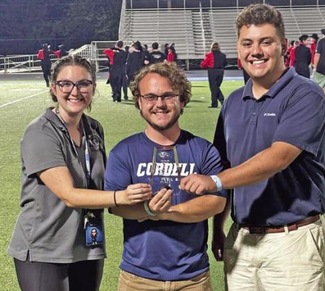 Flag and Vocal Director Elizabeth Edge, Band Director Aaron Edge, and Assistant Band Director Issac Listak