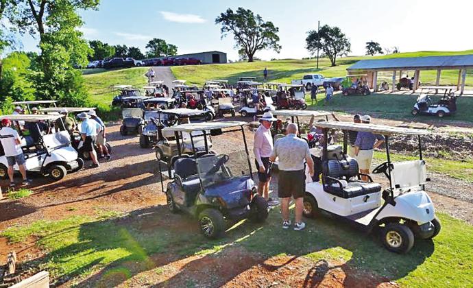Golf carts line up for the tournament- there were 36 teams participating PHOTO BY ALEX ALVAREZ