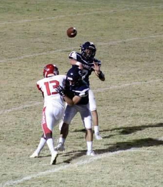 Cordell quarterback Adden Zanghi gets off a pass under pressure from the Frederick defense. Bob Henline | The Cordell Beacon