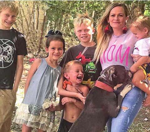 The Ervins: Jay, Kynzlee, Kade, Dayson, Tori, Kaeslyn with their dog, Grace