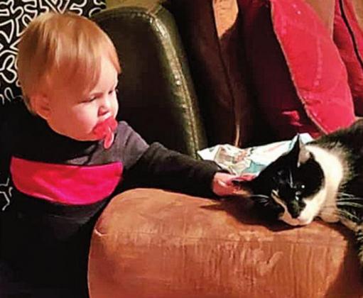 Alex McNeal and the Riggs’ cat, Allan.