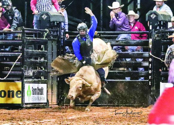 A bull rider competes at the 2025 Elk City Rodeo. This year, the grandstands will be reserved seating. Photo by Terri Abrahamsen.