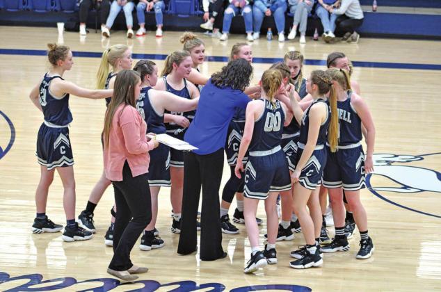 The Lady Blue Devils huddle up before heading into overtime in their game against the Minco Lady Bulldogs PHOTOS BY FLORA WALTERS
