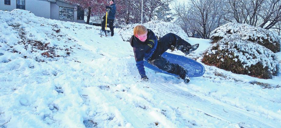 Bryton Yaeger gets some air after riding his sled over a jump.