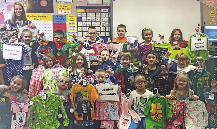Mrs. Powers first grade class in 2014, the first year of participation in the Pajama Drive