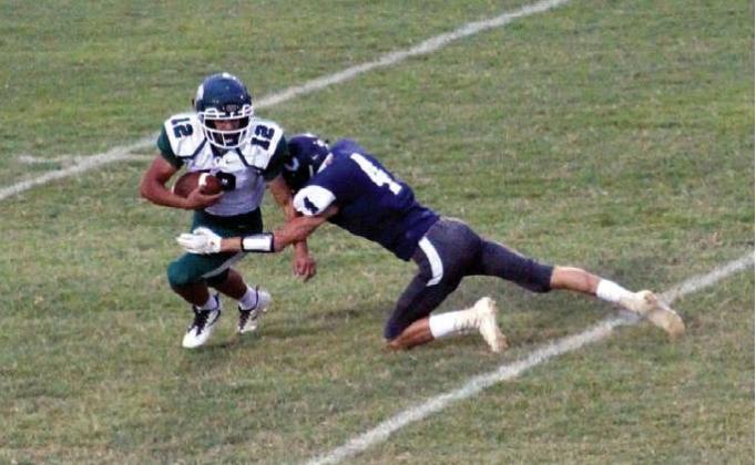 Above: Cordell’s Carsen Nickel penetrates the backfield for a big sack against Thomas. Bob Henline | The Cordell Beacon