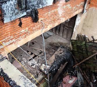 The interior of 106 S College Street, as visible through the missing roof from the back steps of the neigboring building. Bob Henline | The Cordell Beacon