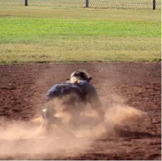 Makenzie Hougland goes to the dirt to make a key stop against Blair. Bob Henline | The Cordell Beacon.