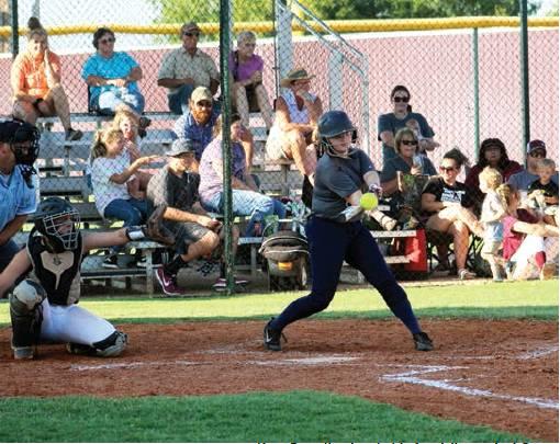 Kara Dowell gets a hold of a strike against Sayre. Bob Henline | The Cordell Beacon
