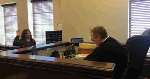 Judge Christopher Kelly swears in Traci Brownen to serve as a Court Appointed Special Advocate, assisting abused/neglected children through the court process. Photo courtesy of Christopher Kelly.
