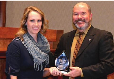 Holding the 2020 Governor’s Communications Effectiveness Award is Information and Education Specialist Kelly Adams and Wildlife Department Director J.D. Strong. The award honored promotional efforts for the Hunters Against Hunger program. Photo courtesy of Don Brown/ODWC
