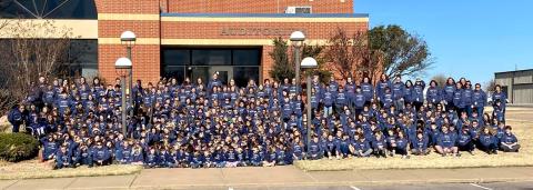 Cordell Elementary students and teachers assemble in front of the school auditorium after receiving their Blue Devil sweatshirts. CONTRIBUTED PHOTO