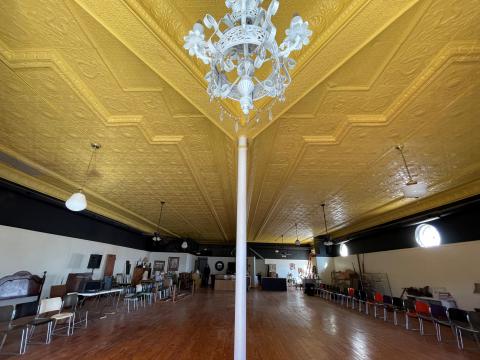  Beautiful tin ceilings and original hardwood floors provide elegance to the lower level. 