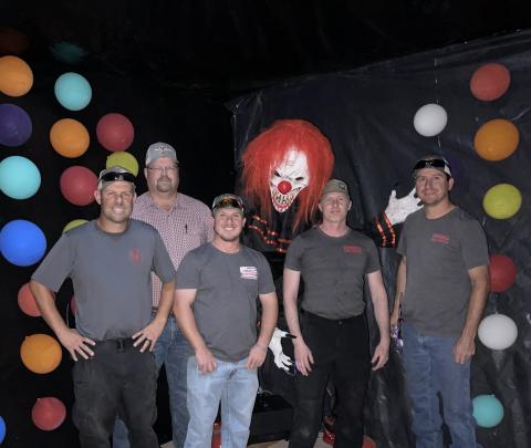 Cordell Fire Department Firemen pose in front of an attraction at the Haunted Morgue (Left to right) Heath Syfert, Levi Jones, Donald Mitchell, Seth Slaughterback, Lincoln Hunter