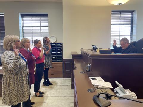 Judge Christopher Kelly swears in new CASA volunteers Kristi Chervenka of Elk City, Briana Wohl of Weatherford, Brenda Quinn of Sayre, and Brandi Kai-CASA