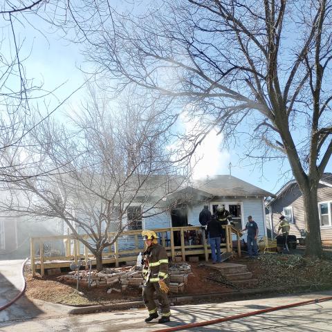 Fireman Lincoln Hunter can be seen in front of the structure fire. Photo by Heather Flores
