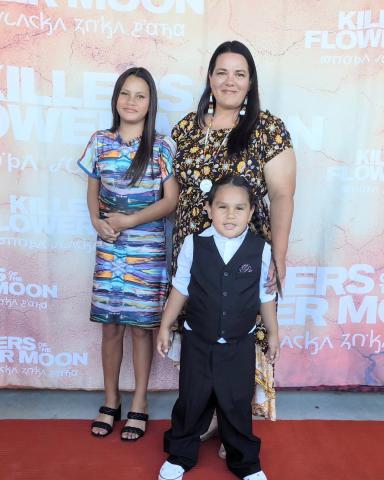 Bravery Nowlin (center), his sister Brynlee, and his Mom Annette Nowlin on the red carpet at a premier of Killers of the Flower Moon CONTRIBUTED PHOTO