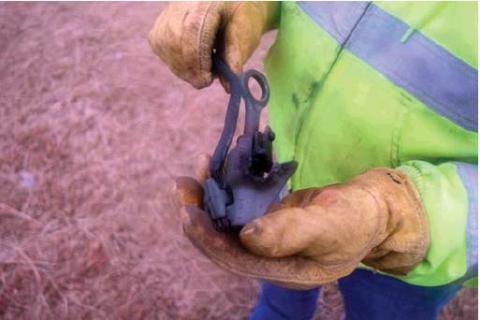Cordell public works director Charlie Brown shows one of the broken connectors which shorted last week, causing the afternoon power outage. Bob Henline | The Cordell Beacon