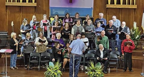 RIGHT: Community choir members rehearse ‘Come Worship the King’ CONTRIBUTED PHOTO