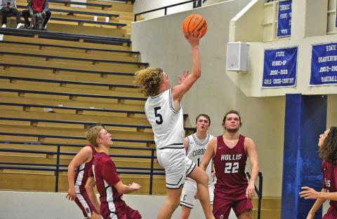 TOP LEFT: Kray Rogers goes up for two points in his team’s win over Hollis.