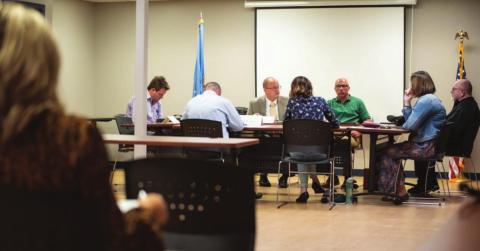 Epic Charter Schools board met in Oklahoma City on Oct. 16, 2019. Left to right: Epic CFO Josh Brock, Superintendent Bart Banfield, attorney Bill Hickman, board members Mike Cantrell and Liberty Mitchell. Facing away are Epic’s compliance officer Tiffany Clark and Board Chairman Doug Scott. (Whitney Bryen/Oklahoma Watch)