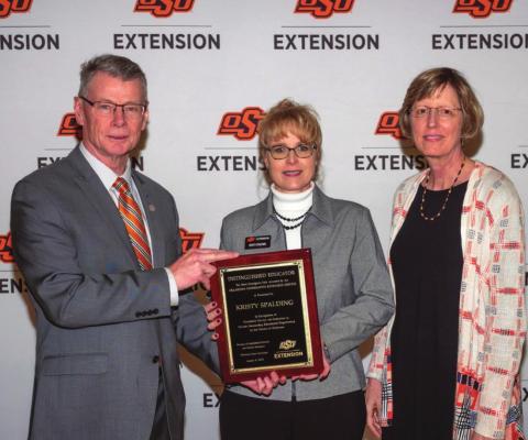 Dr. Tom Coon (left), Vice President, Dean and Director of the Oklahoma State University Division of Agricultural Sciences and Natural Resources (DASNR) awarded Kristy Spalding (middle), Washita &amp; Beckham County Extension Educator, Family Consumer Sciences/4-H Youth Development and CED with the Oklahoma Cooperative Extension Service Distinguished Educator title with Dr. Damona Doye (right), Associate Vice President, Oklahoma Cooperative Extension. Photo courtesy of Dana Church.