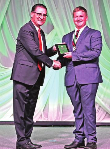 Barnett Barnett, representing Burns Flat-Dill City 4-H, was named the state record book winner in the advanced fabrics and fashions project and was presented with a $1,200 educational scholarship from Executive Director of the Oklahoma 4-H Foundation, Milford Jenkins and sponsored by the Wilma Wendt Pattillo Endowment. CONTRIBUTED PHOTO