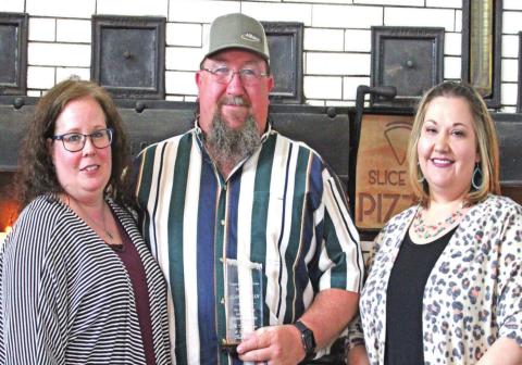 Alan Newman (center) is the 2021 Cordell Beacon and Great Plains Bank Person of the Year. Cordell Beacon General Manager Heather Flores (right) presented him with the award as his wife, Lana (left) watched proudly. He gave credit to his family for supporting him in his community work. PHOTO BY FLORA WALTERS