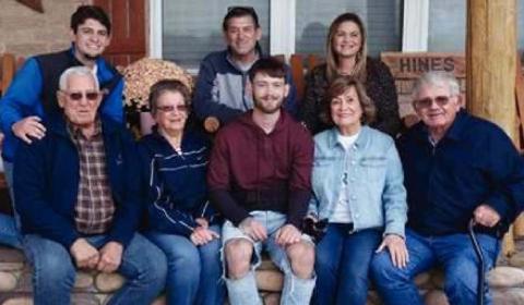 TOP: Scott Hines, center top, sits surrounded by his family. BELOW: Scott Hines receives a surprise visit from the Fort Cobb baseball team on their way to the state tournament. CONTRIBUTED PHOTOS