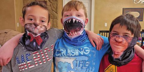 Heather Raleigh, Cameron Raleigh and Michael Raleigh show off their very cool face coverings.