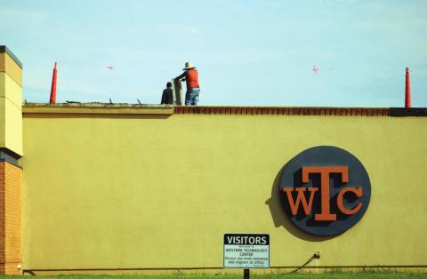 Photo: Workers from Nurnberg Roofing work on the WTC roof. Bob Henline, The Cordell Beacon