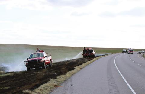 Cordell fire crews mop up a one-acre grass fire north of Cordell Feb. 25. Bob Henline I The Cordell Beacon