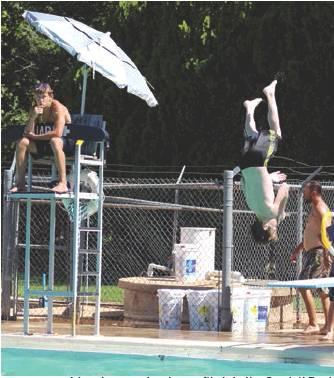 A local youngster does a flip into the Cordell Pool Aidyn Henline | The Cordell Beacon