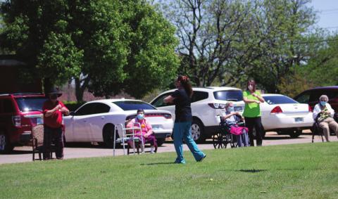 Photo: Cordell Christian Home staff lead exercises for the residents Thursday, April 23. Bob Henline Cordell Beacon